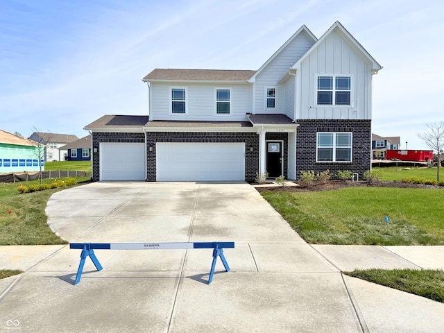 5879 Handbell Ln, Greenwood, IN 46143 - view of front of home with concrete driveway, a garage, brick siding, board and batten siding, and a front yard