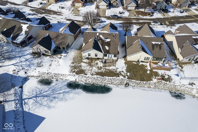 snowy aerial view with a residential view