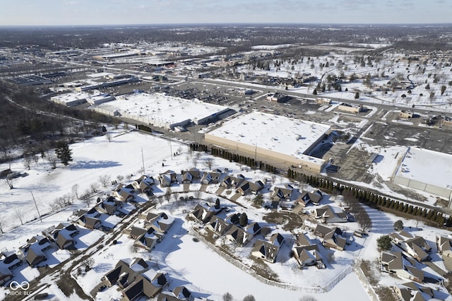 snowy aerial view with a residential view