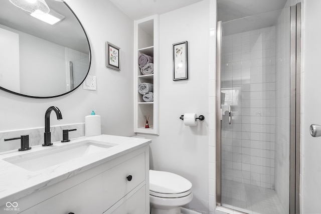 full bath with a stall shower, vanity, and toilet