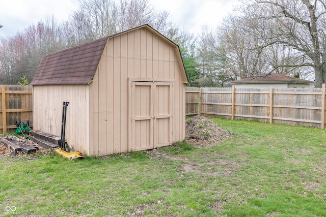 view of shed with a fenced backyard