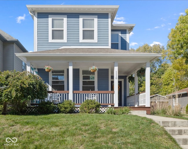 view of front of house featuring covered porch and a front lawn