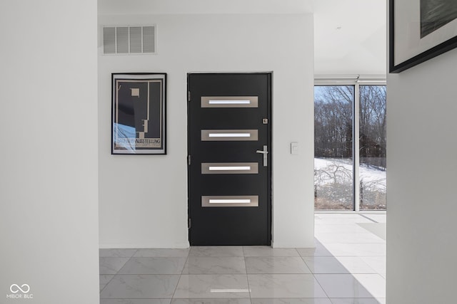 entrance foyer featuring marble finish floor and visible vents