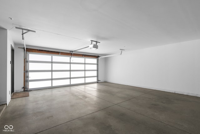 garage featuring baseboards and a garage door opener