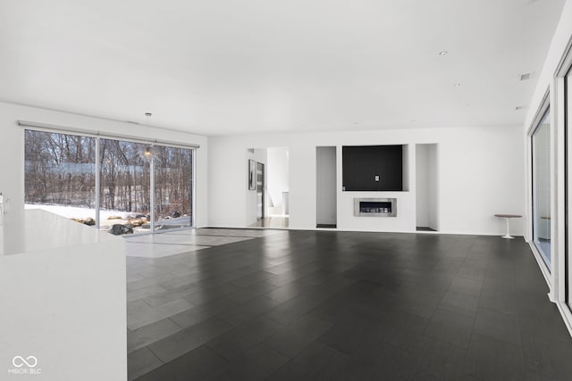 unfurnished living room with a fireplace