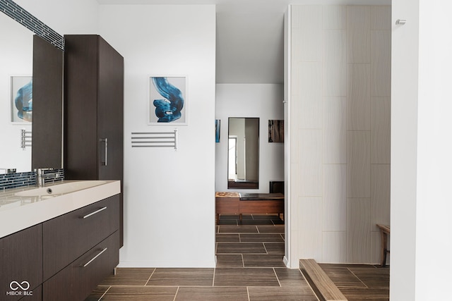 bathroom featuring wood tiled floor and vanity