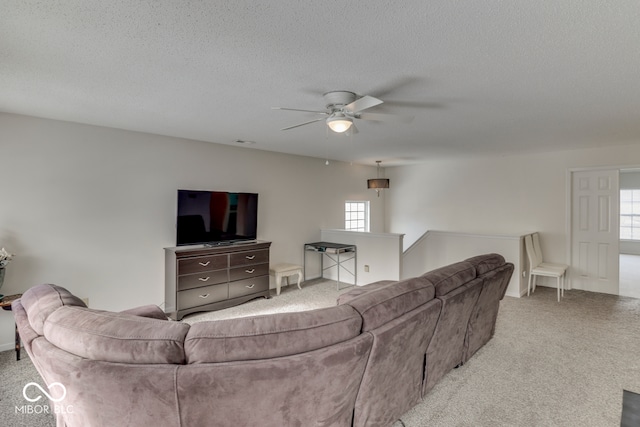 387 Legacy Blvd, Greenwood, IN 46143 - carpeted living area with ceiling fan and a textured ceiling