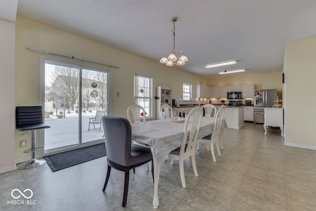 387 Legacy Blvd, Greenwood, IN 46143 - dining area featuring a chandelier and baseboards