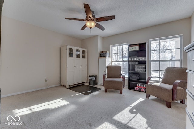 387 Legacy Blvd, Greenwood, IN 46143 - living area featuring carpet flooring, ceiling fan, and baseboards