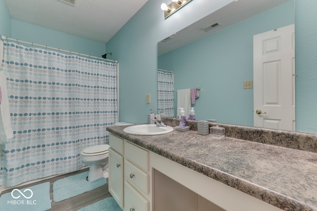 387 Legacy Blvd, Greenwood, IN 46143 - full bath with toilet, vanity, wood finished floors, and a shower with shower curtain
