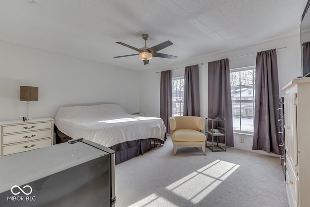 387 Legacy Blvd, Greenwood, IN 46143 - bedroom featuring light colored carpet, ceiling fan, and a textured ceiling