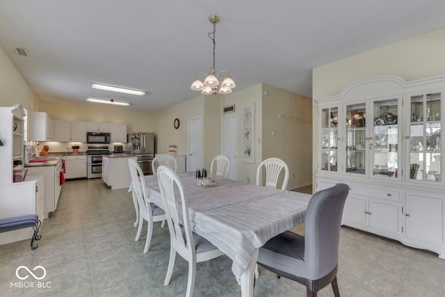 387 Legacy Blvd, Greenwood, IN 46143 - dining area featuring a chandelier