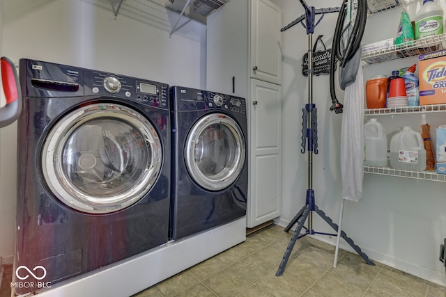 387 Legacy Blvd, Greenwood, IN 46143 - laundry area with cabinet space and washing machine and clothes dryer