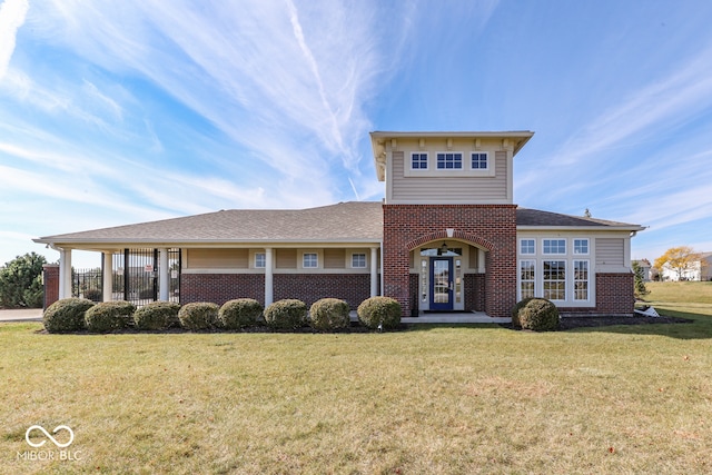 387 Legacy Blvd, Greenwood, IN 46143 - view of front facade featuring brick siding, french doors, a front lawn, and roof with shingles