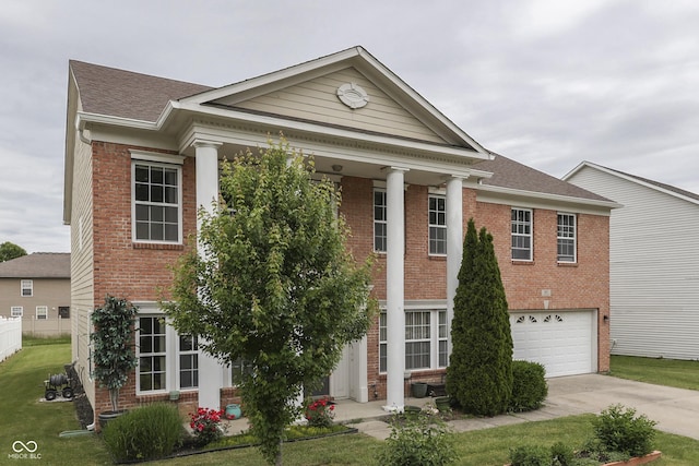 387 Legacy Blvd, Greenwood, IN 46143 - neoclassical home featuring brick siding, concrete driveway, an attached garage, and roof with shingles
