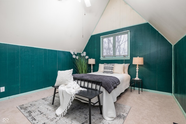 carpeted bedroom with lofted ceiling and a ceiling fan