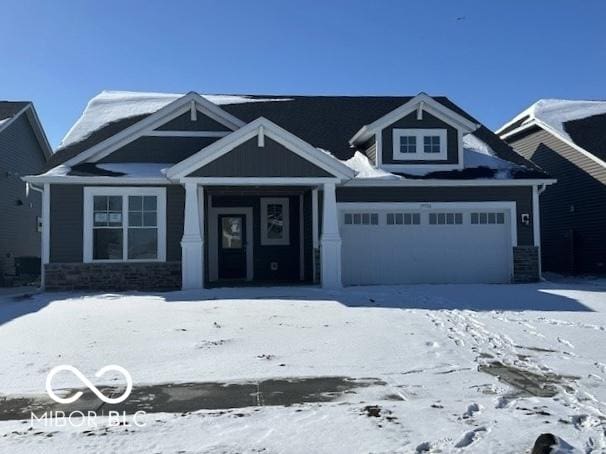 craftsman house featuring stone siding