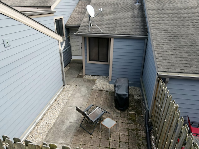 view of patio featuring fence