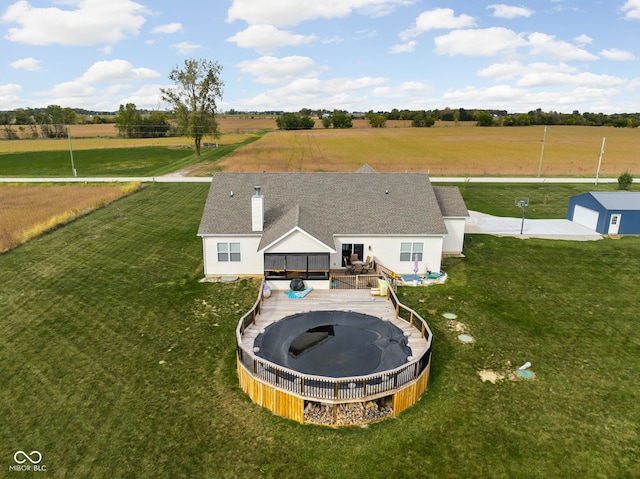 birds eye view of property featuring a rural view