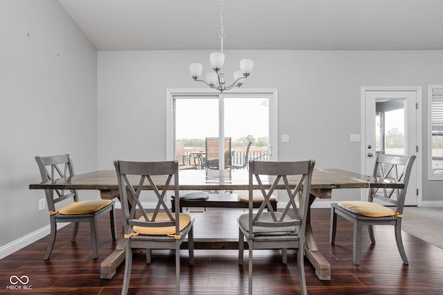 dining room with baseboards, dark wood-style flooring, and a notable chandelier