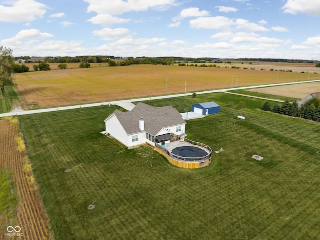 birds eye view of property with a rural view