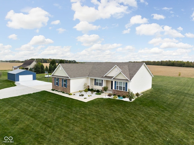 ranch-style house with an outbuilding, a front lawn, brick siding, and a garage