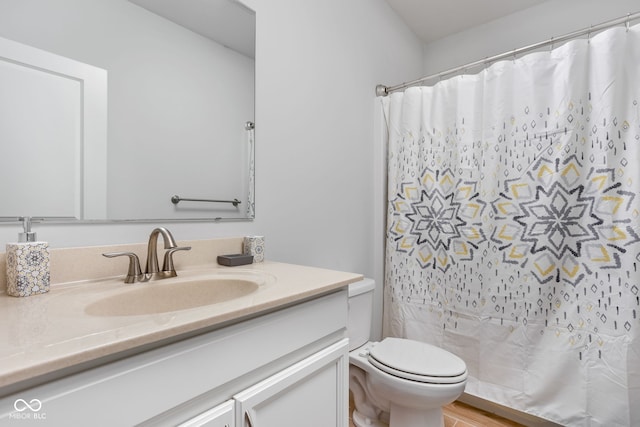 full bathroom with toilet, vanity, and a shower with shower curtain