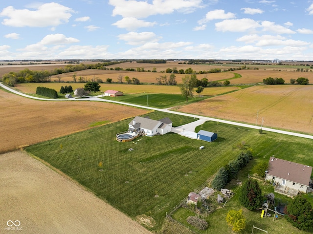 birds eye view of property featuring a rural view