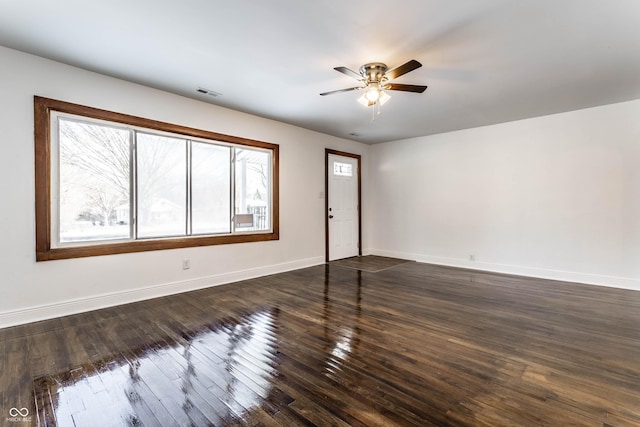 unfurnished living room featuring ceiling fan, baseboards, a healthy amount of sunlight, and visible vents