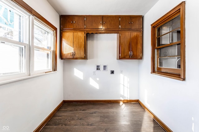 laundry area with hookup for a washing machine, baseboards, electric dryer hookup, cabinet space, and dark wood-style flooring