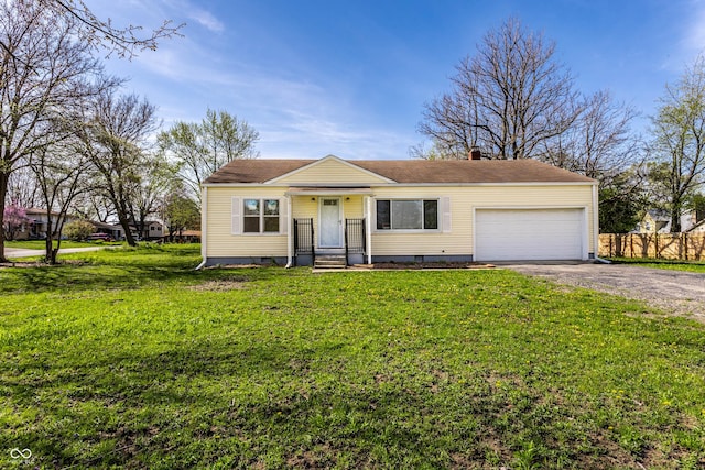 view of front of home with a garage, driveway, a front yard, and fence