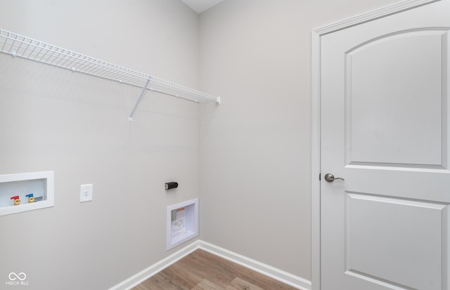 washroom with laundry area, washer hookup, wood finished floors, baseboards, and electric dryer hookup