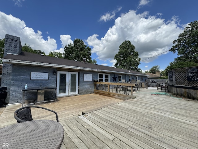 wooden deck featuring french doors