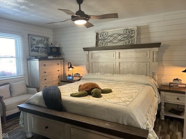 bedroom with dark wood-style floors and a ceiling fan