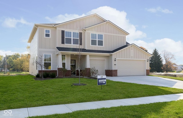 view of front of home with a garage, brick siding, concrete driveway, a front lawn, and board and batten siding