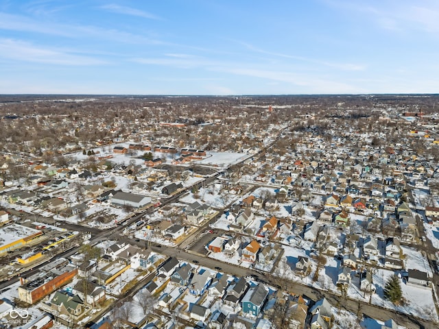 snowy aerial view with a residential view