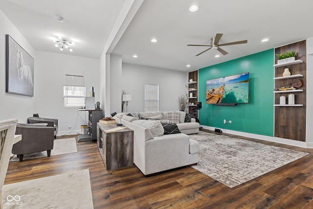 living room featuring dark wood-style floors, baseboards, a ceiling fan, and recessed lighting