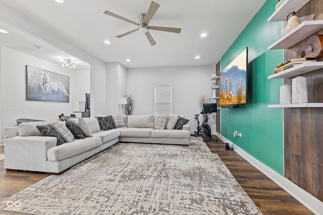 living room featuring a ceiling fan, recessed lighting, dark wood finished floors, and baseboards