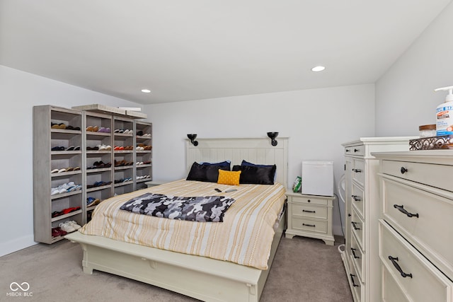 bedroom featuring light carpet and recessed lighting