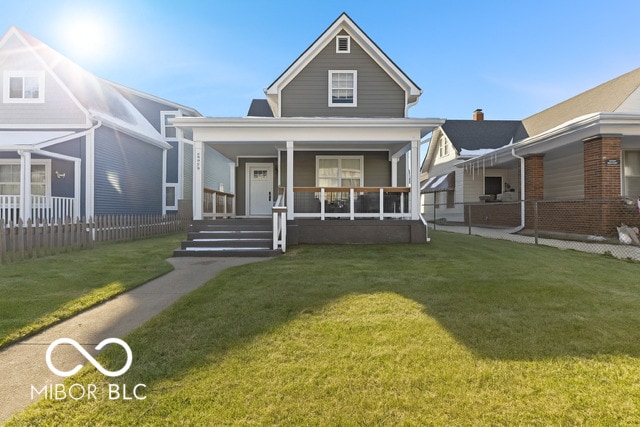 234 N State Ave, Indianapolis, IN 46201 - view of front of property with covered porch and a front lawn