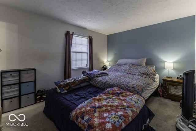 bedroom with light colored carpet and a textured ceiling