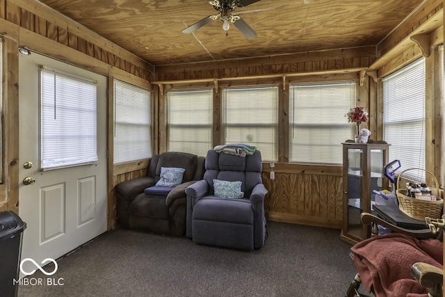 sunroom / solarium with wood ceiling and ceiling fan