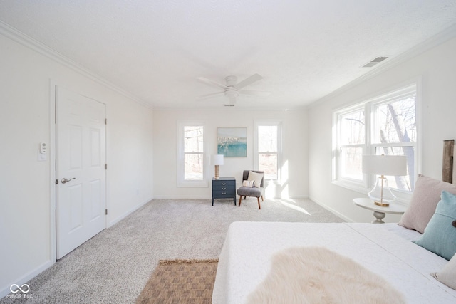 bedroom featuring light carpet, ornamental molding, visible vents, and baseboards