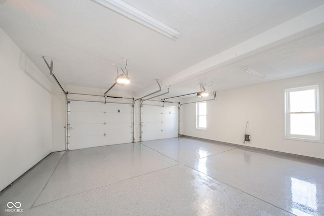 garage featuring baseboards and a garage door opener