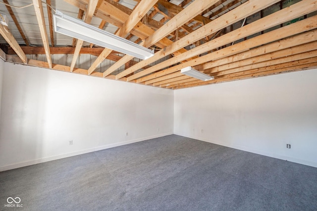 basement featuring carpet floors and baseboards