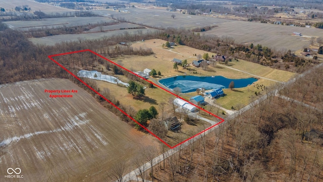 aerial view with a rural view and a water view