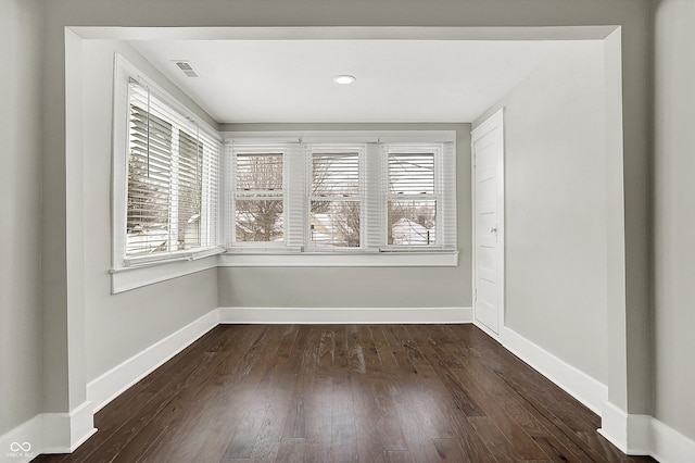 5053 E Michigan St, Indianapolis, IN 46201 - spare room with plenty of natural light, dark wood-style flooring, and baseboards