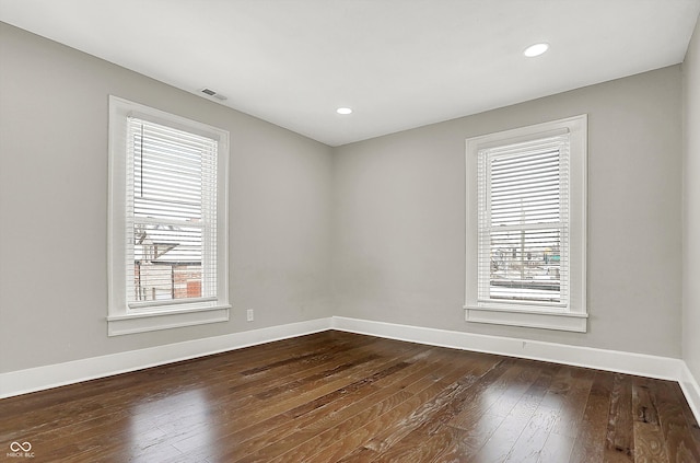 5053 E Michigan St, Indianapolis, IN 46201 - spare room with healthy amount of natural light, dark wood-style floors, baseboards, and recessed lighting