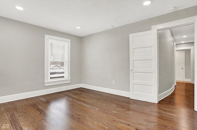 5053 E Michigan St, Indianapolis, IN 46201 - empty room featuring wood-type flooring, a smoke detector, baseboards, and recessed lighting