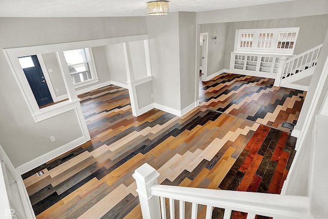 5053 E Michigan St, Indianapolis, IN 46201 - stairs featuring wood-type flooring, baseboards, and vaulted ceiling